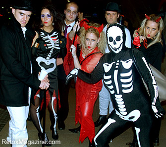 Halloween night: partygoers dressed as devils, demons and skeletons hit the streets of London