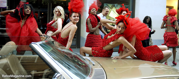 Pierre Garroudi models on top of the car in Mayfair, London